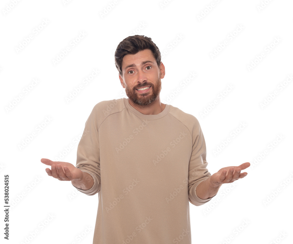 Embarrassed man in pullover on white background Embarrassed man in pullover on white background