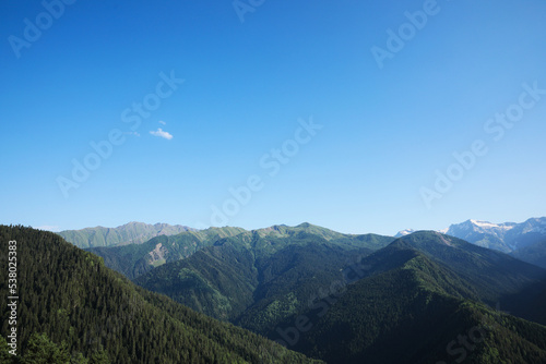 Aerial view of beautiful landscape with mountain forest on sunny day