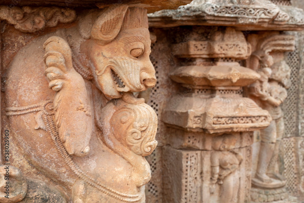 Selective Focus Ancient Lion Statue or Mythical Lion sculpture on the walls of the ancient 13th century A.D. Suka Sari temples, Old Town, Odisha, India.