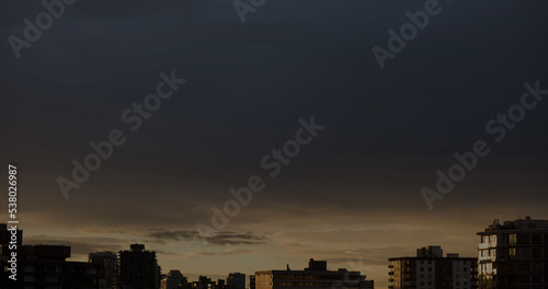 Composition of clouds and sky over cityscape