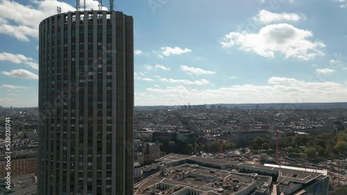 Hyatt Regency Paris Étoile hotel and Congress palace with cityscape, France. Aerial drone tilt down ascending photo