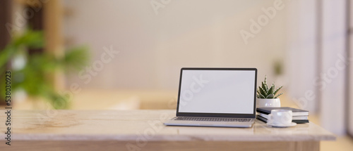 Close-up, Luxury bright workspace with laptop mockup and copy space on white marble tabletop