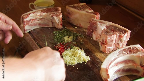 preparing a rack of lamb and chops with soices photo