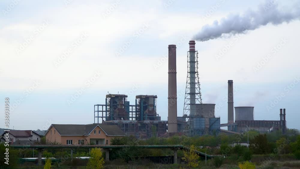 The chimney of a thermal power plant, the smoke extracted by a thermal power plant on the chimney, in the production process. Environment. Pollution. 4k video. The chimney of a thermal power plant, the smoke extracted by a thermal power plant on the chimney, in the production process. Environment. Pollution. 4k video.
