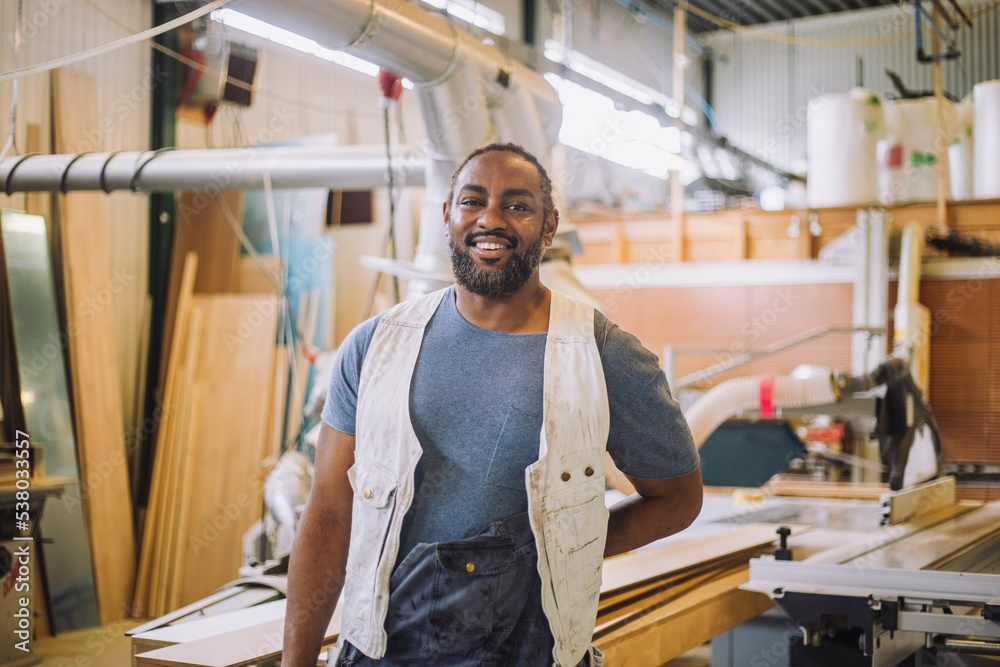Portrait of happy male carpenter in workshop Portrait of happy male carpenter in workshop