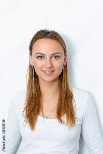 close-up of young blonde woman on white background