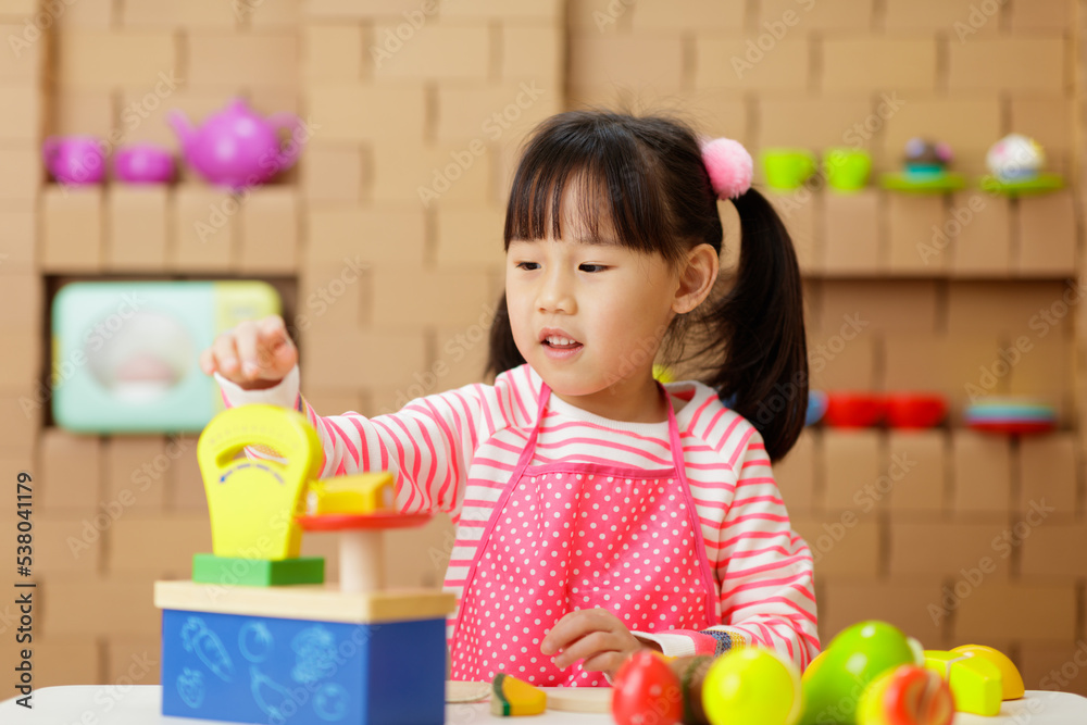 young girl pretend playing food preparing at home young girl pretend playing food preparing at home