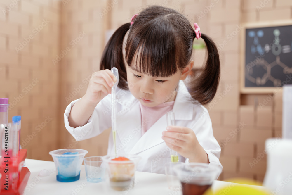 young girl plays science experiment for home schooling young girl plays science experiment for home schooling