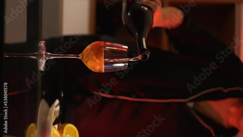 The girl pours a cocktail in the home bar. Negroni sbagliato alcoholic drink from the Game of Thrones actress. Vertical video. High quality FullHD footage photo