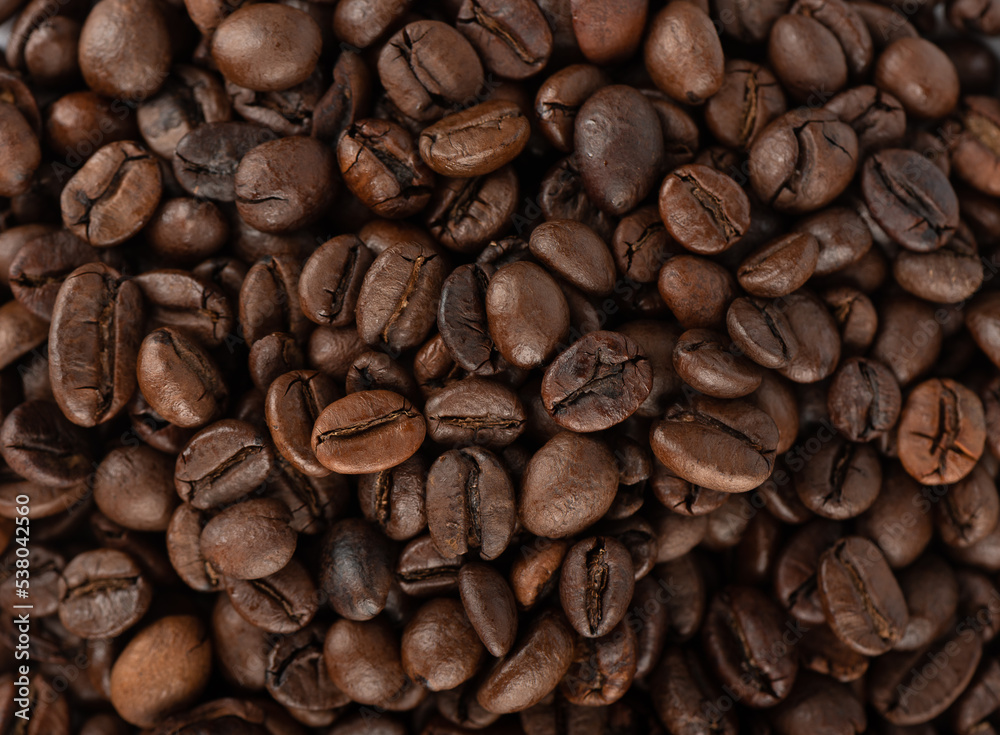Full frame of roasted Robusta and Arabica coffee beans. Full frame of roasted Robusta and Arabica coffee beans.