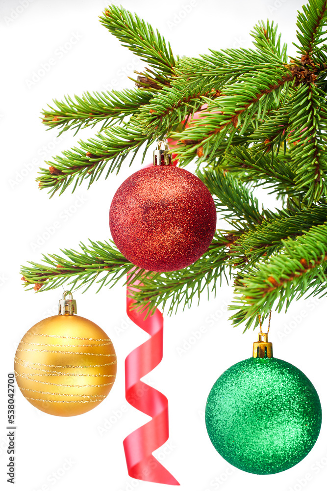 Spruce branch with Christmas balls and red ribbon on a white background isolate