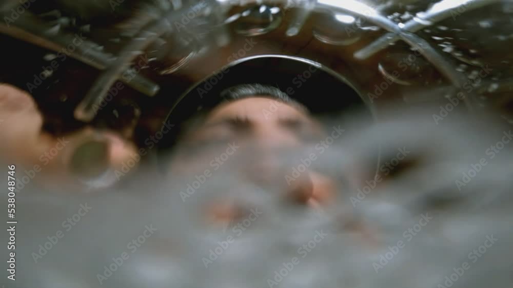 4K Man drinking beer or water . Beer pouring into mouth . Camera inside of beer glass or cup . Very funny angle view of camera . Close up