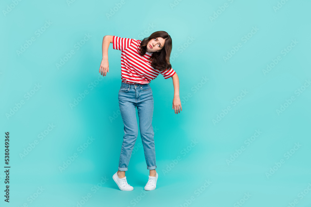 Full length photo of dissatisfied lady unwell unhealthy dressed striped trendy outfit look empty space isolated on cyan color background Full length photo of dissatisfied lady unwell unhealthy dressed striped trendy outfit look empty space isolated on cyan color background