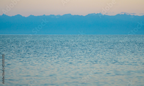 The surface of the water in the Issyk Kul mountain lake in Kyrgyzstan at sunset