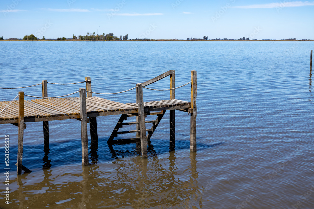 Small wooden pier on a lagoon.
