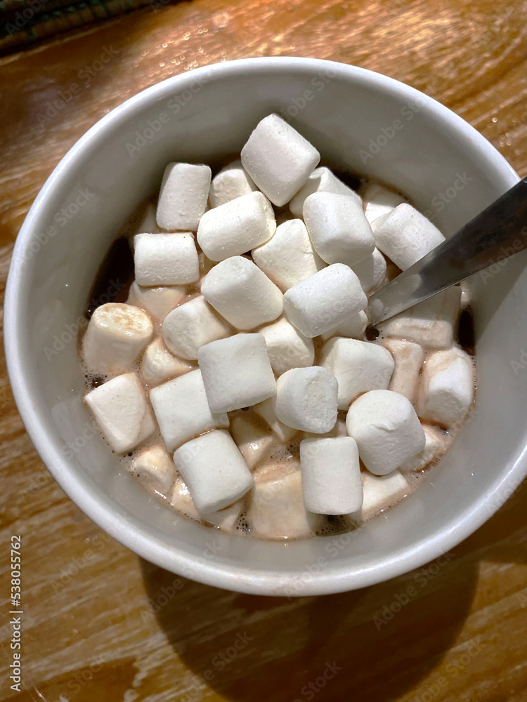 top view of a grey mug with hot chocolate and marshmallows top view of a grey mug with hot chocolate and marshmallows