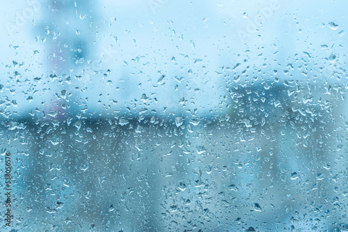 Bad weather day, rain on glass. Condensation on clear glass window. Water drops. Rain. Abstract background texture