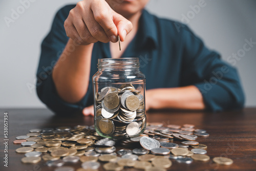 Saving investment banking finance concept. Stack of coins with piggy bank on the table. Growth of loan and investment business idea. Asset Management, Funds, Liabilities, Deposits, Income, Successful.