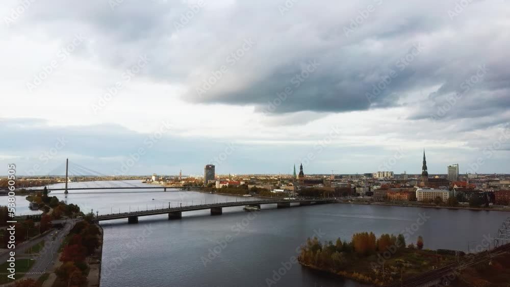 Aerial View of Riga City the Capital of Latvia. Amazing View on the River Daugava, Old Town, National Library, Bridges Over the River and the Main Tv Tower. View From Above During Autumn Cloudy Day 4K Aerial View of Riga City the Capital of Latvia. Amazing View on the River Daugava, Old Town, National Library, Bridges Over the River and the Main Tv Tower. View From Above During Autumn Cloudy Day 4K