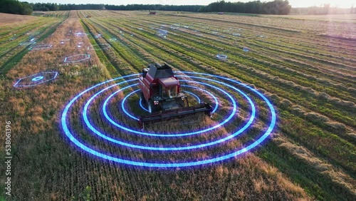 Agricultural autonomous combine harvester, moving across the field, controlled by artificial intelligence, scans the environment. Concept of smart self-driving transport, agriculture of the future.