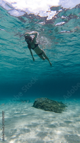 girl diving in mediterranean sea  © Komposit studio