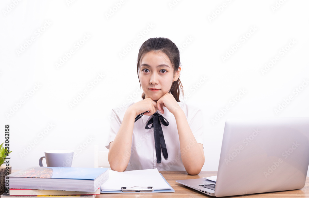 Asian female students taking an online class against a white background Asian female students taking an online class against a white background