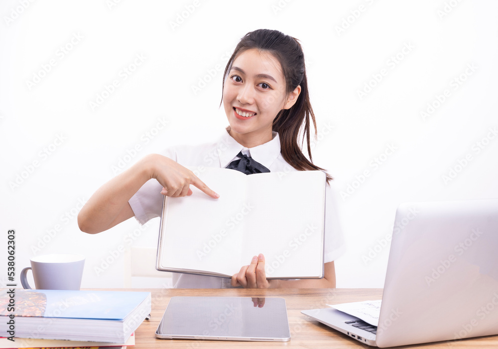 Asian female students taking an online class against a white background Asian female students taking an online class against a white background