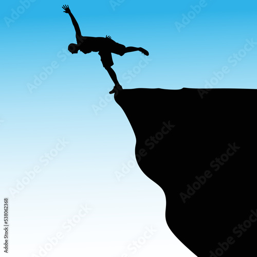 Silhouette of standing man on cliff