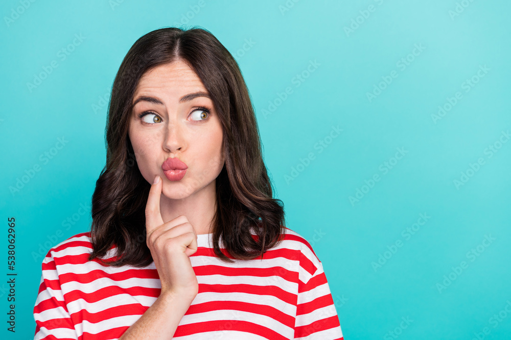 Closeup photo of young gorgeous woman wear striped t-shirt pouted lips kiss touch cheeks dreamy look empty space isolated on cyan color background Closeup photo of young gorgeous woman wear striped t-shirt pouted lips kiss touch cheeks dreamy look empty space isolated on cyan color background