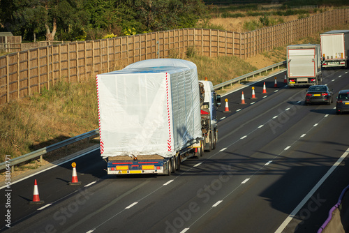 heavy traffic in blurry motion on UK motorway in England photo