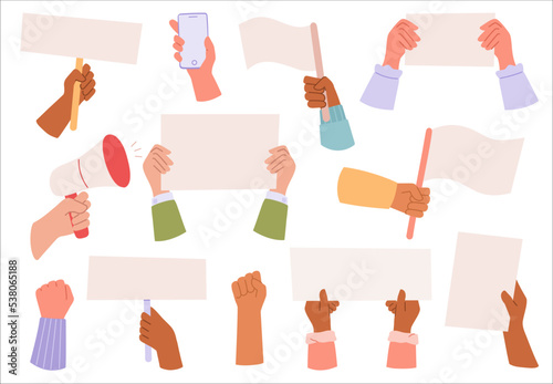 Hands holding papers, flags, and banners. Fit up and hand with amplifier that symbolize protest or demonstration.