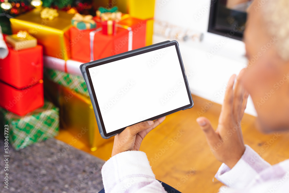 Happy african american woman using tablet with copy space Happy african american woman using tablet with copy space