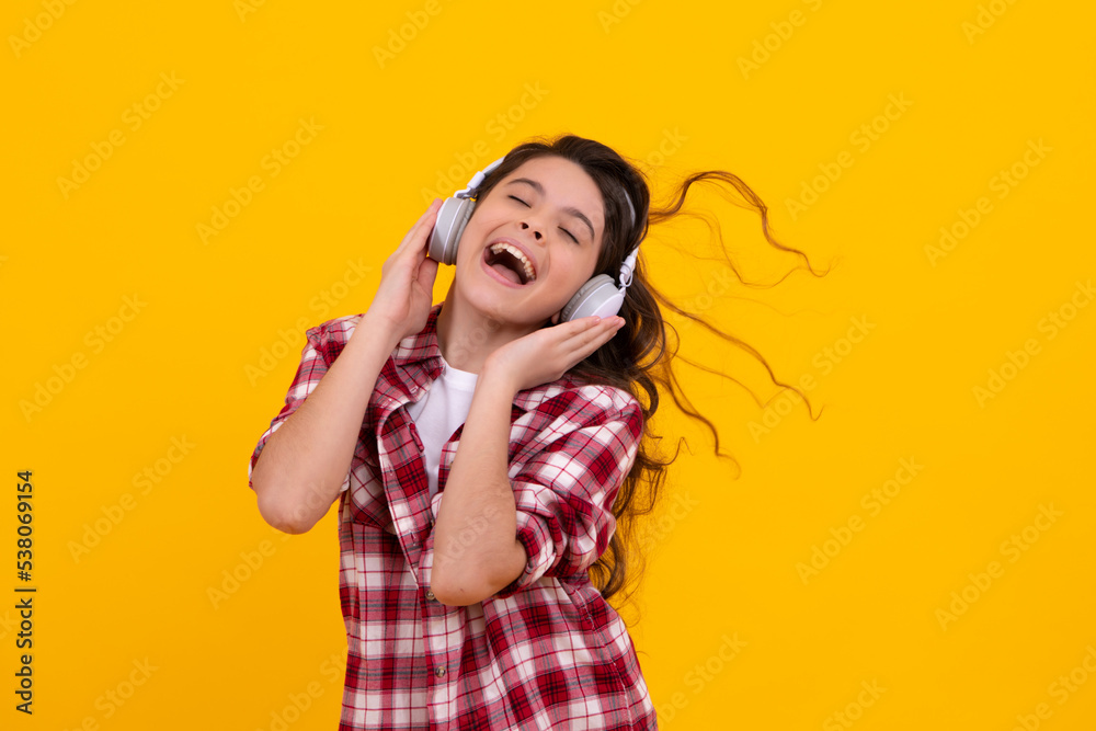 Funny kid girl 12, 13, 14 years old listen music with headphones. Teenage  girl with headphones listening songs on headset earphone. Happy teenager,  positive and smiling emotions of teen girl. Stock Photo | Adobe Stock