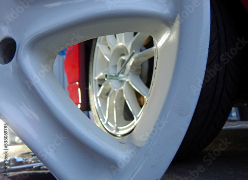 Tire fitting service station. Replacing an old wheel with a new one stock photo 