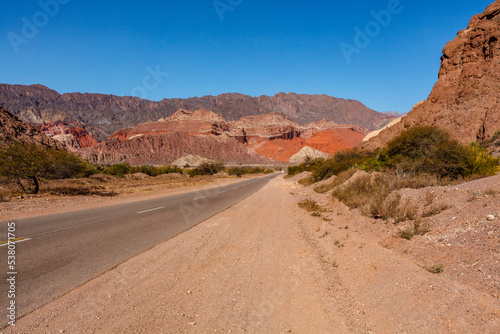 Road through the red rocks of Quebrada de Cafayate, Salta, Argentina, South America