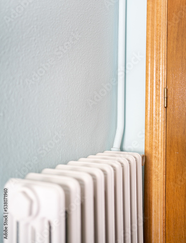 Wallpaper Mural Heating radiator with external installation and external pipe at home Torontodigital.ca