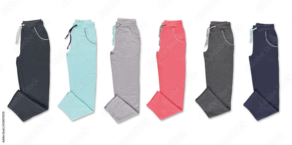 Collection of colored trousers on a white background. Isolated image on a white background. Nobody. Collection of colored trousers on a white background. Isolated image on a white background. Nobody.