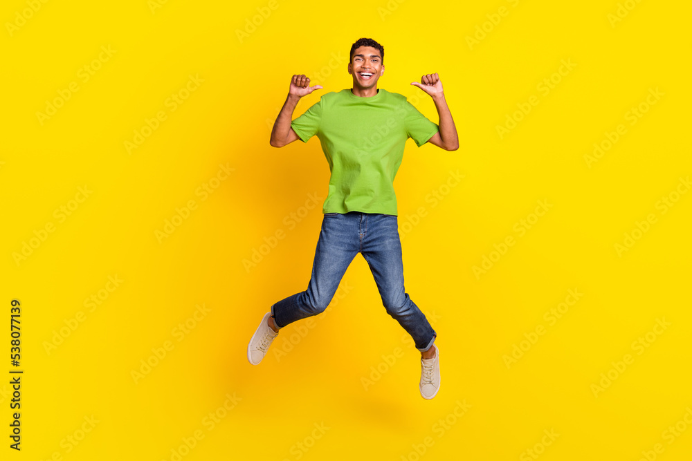 Full size photo of overjoyed excited man jumping point fingers self himself isolated on yellow color background