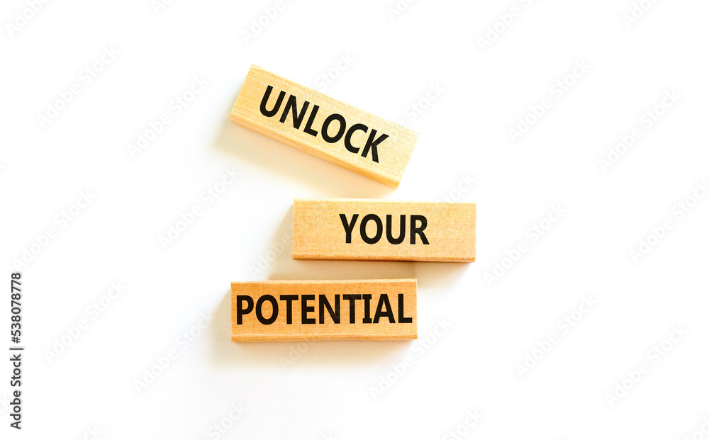 Unlock your potential symbol. Concept words Unlock your potential on wooden blocks. Beautiful white table white background. Business, psychological unlock your potential concept. Copy space. Unlock your potential symbol. Concept words Unlock your potential on wooden blocks. Beautiful white table white background. Business, psychological unlock your potential concept. Copy space.