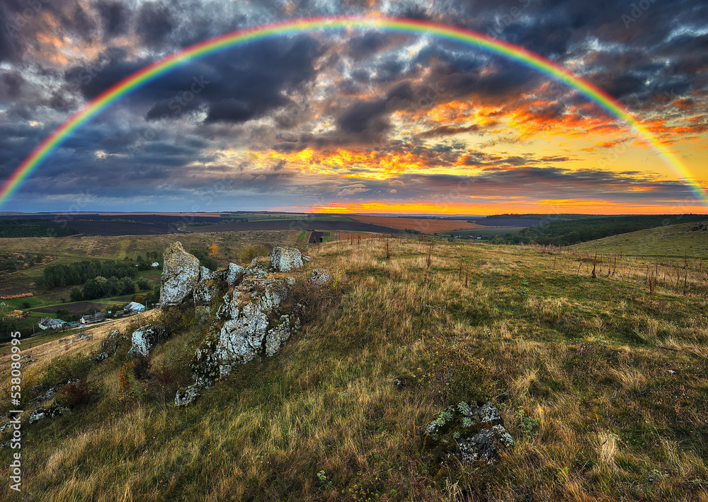 Rainbow with clouds over the canyon. autumn landscape. nature of Ukraine