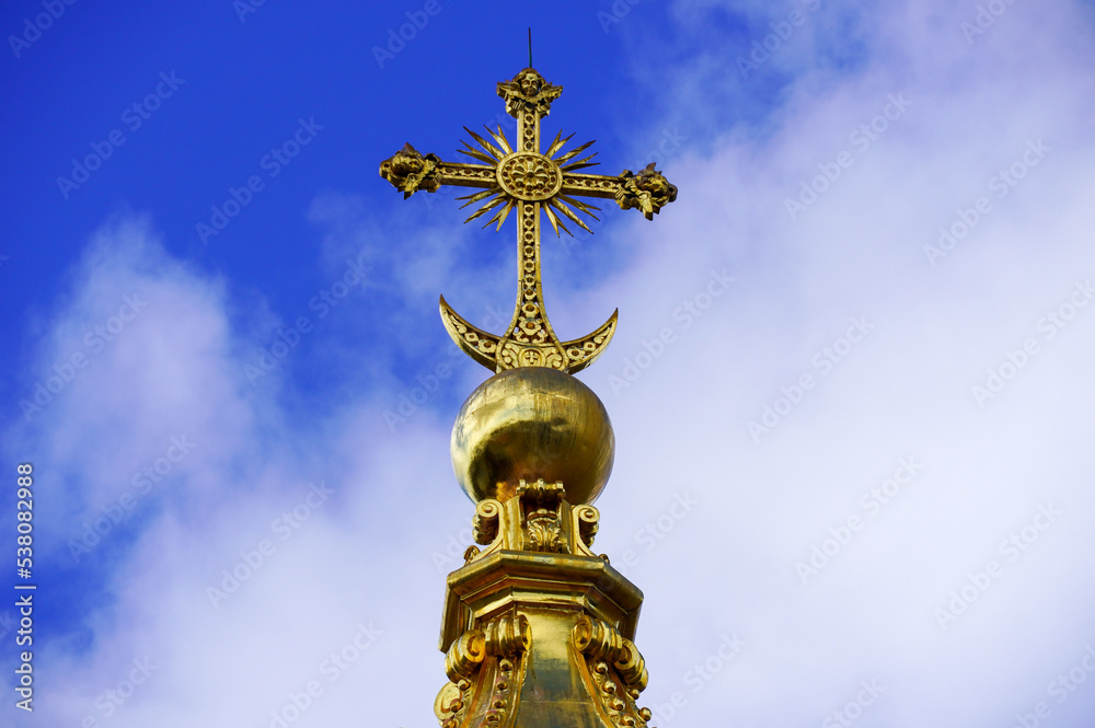 Orthodox church with golden domes and crosses in Peterhof. Against the blue sky in summer. High quality photo