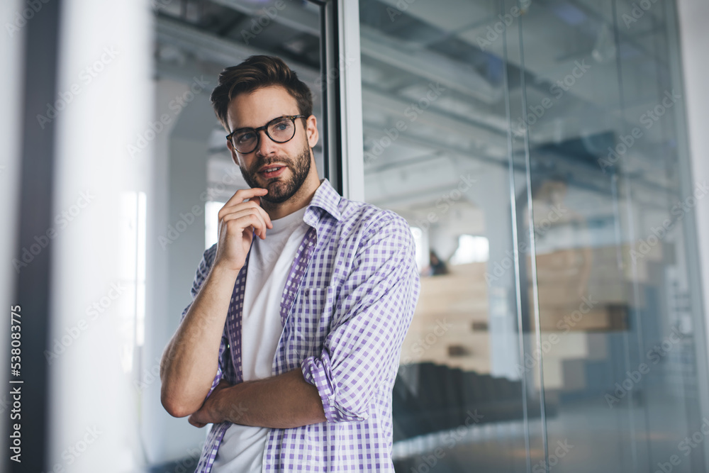 Millennial caucasian business man posing in office Millennial caucasian business man posing in office
