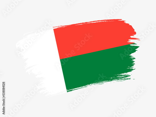 Madagascar flag made in textured brush stroke. Patriotic country flag on white background