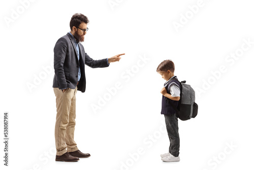 Full length shot of a man scolding a schoolboy photo
