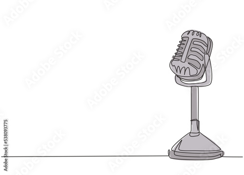 One single line drawing of retro old classic radio microphone for broadcasting. Vintage loudspeaker announcer item concept continuous line draw design vector graphic illustration