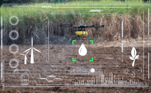 Smart farmer working by agricultural drone, spraying drone fertilizing in sugar cane farm photo