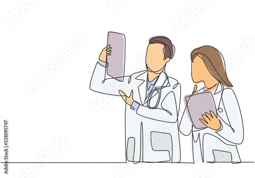 One continuous single line drawing of young male and female doctor discussing and diagnosing patient x-ray photo result together. Medical healthcare concept single line draw design vector illustration