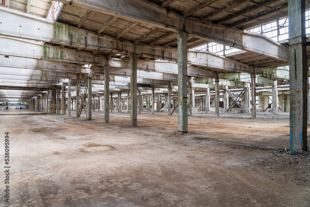 Ruined industrial area, abandoned ruins of a plant or factory. Huge vacant lot. Background