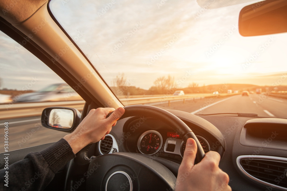 driving on highway, high speed, hands of driver closeup driving on highway, high speed, hands of driver closeup