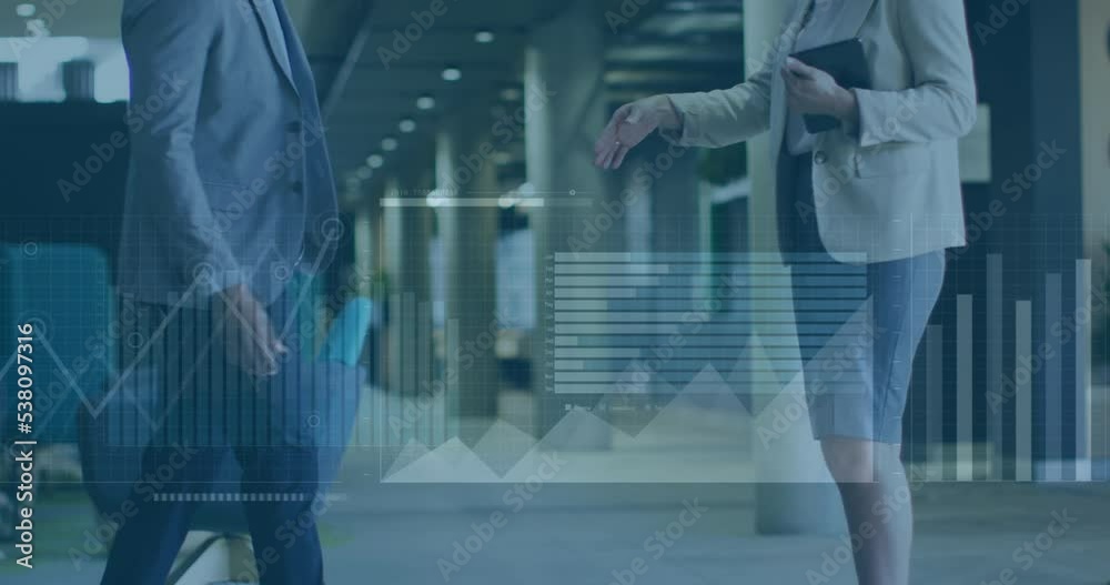 Animation of financial data processing over two diverse business people Animation of financial data processing over two diverse business people